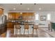 Modern kitchen with an island, stainless steel appliances, and stylish pendant lighting at 18875 W 93Rd Ave, Arvada, CO 80007