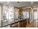 Bright kitchen with a large island, stainless steel appliances, ample cabinets, and an open layout at 18875 W 93Rd Ave, Arvada, CO 80007