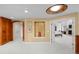 Stylish hallway leading to the primary bedroom, showcasing art niche and decorative lighting at 5 Redhawk Run, Cherry Hills Village, CO 80113