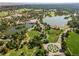 Breathtaking aerial view of the property showcasing lush green surroundings and scenic lake at 1541 Glencoe St, Denver, CO 80220