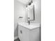 Modern bathroom vanity with white countertops, sleek sink and black faucet at 1541 Glencoe St, Denver, CO 80220