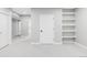 Spacious bedroom featuring neutral paint, carpet, built-in shelves, and recessed lighting at 1541 Glencoe St, Denver, CO 80220