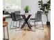 Stylish dining area with round glass table, modern chairs, and natural light at 1541 Glencoe St, Denver, CO 80220