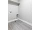 Clean laundry room with tile floors, simple layout, and basic utilities at 1541 Glencoe St, Denver, CO 80220