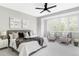 Serene main bedroom with large bed, stylish decor, and bright natural light at 1541 Glencoe St, Denver, CO 80220