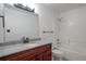 Bathroom with a granite vanity and combined tub and shower at 3855 Canyon Ranch Rd # 104, Highlands Ranch, CO 80126