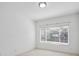 Bright room with a large window and neutral carpet at 3855 Canyon Ranch Rd # 104, Highlands Ranch, CO 80126