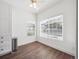 Bedroom featuring bright natural light, hardwood floors, and a ceiling fan at 3855 Canyon Ranch Rd # 104, Highlands Ranch, CO 80126