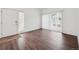 Bright entryway with hardwood floors, white walls, and a door to the outside at 3855 Canyon Ranch Rd # 104, Highlands Ranch, CO 80126