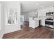 Charming kitchen with stainless steel appliances, white cabinets, and open floor plan at 3855 Canyon Ranch Rd # 104, Highlands Ranch, CO 80126