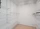 Spacious walk-in closet with ample shelving at 3855 Canyon Ranch Rd # 104, Highlands Ranch, CO 80126