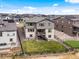 This aerial view showcases the home, yard, and surrounding neighborhood at 3187 S Quaker St, Morrison, CO 80465