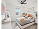 Inviting bedroom features a cozy bed, stylish decor, and a bright window view at 3187 S Quaker St, Morrison, CO 80465