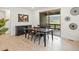 Dining area with a wooden table, seating for four, and sliding glass doors to the outside at 3187 S Quaker St, Morrison, CO 80465