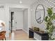 Stylish foyer with patterned wallpaper, wood floors, and decorative mirror at 3187 S Quaker St, Morrison, CO 80465