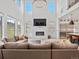 Spacious living area with modern fireplace, open to kitchen, and views at 3187 S Quaker St, Morrison, CO 80465
