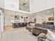 Bright, open-concept living space with high ceilings and a view into the kitchen and dining area at 3187 S Quaker St, Morrison, CO 80465