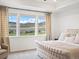 Cozy primary bedroom with a plush bed, scenic views and neutral colors at 3187 S Quaker St, Morrison, CO 80465