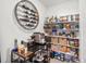 Organized pantry with shelving, countertop, wine rack, and various storage baskets and containers at 3187 S Quaker St, Morrison, CO 80465