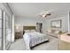 Bright bedroom with a ceiling fan, large windows, and neutral décor at 1303 S Danube Way # 104, Aurora, CO 80017