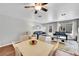Open-concept living area with hardwood floors, recessed lighting, and neutral paint at 1303 S Danube Way # 104, Aurora, CO 80017