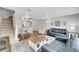 An open concept living and dining area with hardwood floors and recessed lighting at 1303 S Danube Way # 104, Aurora, CO 80017