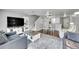 Open-concept living area with hardwood floors, recessed lighting, and neutral paint at 1303 S Danube Way # 104, Aurora, CO 80017