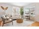 Bright living room features natural light, modern furnishings, and decorative accents at 2482 Otis Ct, Edgewater, CO 80214