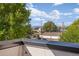 Enjoy sweeping city views from your private balcony with lush trees enhancing the peaceful atmosphere at 1415 Irving St, Denver, CO 80204