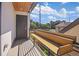 A spacious balcony with built-in seating offers serene outdoor living with neighborhood views at 1415 Irving St, Denver, CO 80204
