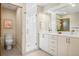 Elegant bathroom with double vanity, glass shower, and modern fixtures at 1415 Irving St, Denver, CO 80204