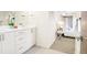 Clean and modern bathroom featuring double sinks and a large mirror at 1415 Irving St, Denver, CO 80204
