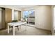 Sunlit home office offers an inviting workspace, and large windows open to a private balcony at 1415 Irving St, Denver, CO 80204