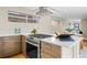 Modern kitchen with stainless steel appliances, a gas range, and sleek countertops at 1415 Irving St, Denver, CO 80204