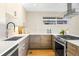 Stylish kitchen with custom cabinets, quartz countertops, and stainless-steel gas range at 1415 Irving St, Denver, CO 80204