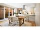 A contemporary dining area blends seamlessly with a stylish kitchen and outdoor access at 1415 Irving St, Denver, CO 80204