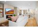 Bright living room with fireplace, open to a modern kitchen and access to the outdoor patio at 1415 Irving St, Denver, CO 80204
