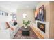Cozy living room featuring a fireplace, mounted TV, and stylish decor at 1415 Irving St, Denver, CO 80204