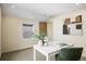 A bright office space is accented by artwork and a modern lamp on a sleek white desk at 1415 Irving St, Denver, CO 80204