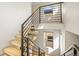 A modern staircase with light wood treads and a sleek black railing ascends to the next level at 1415 Irving St, Denver, CO 80204