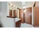 Bright bathroom featuring ample vanity storage, a skylight, and a clean, modern design at 6057 S Pierson St, Littleton, CO 80127