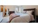 Serene bedroom with a large bed, soft lighting, and a peaceful ambiance at 6057 S Pierson St, Littleton, CO 80127