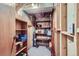 Functional storage space with wooden shelving, ideal for organizing household items at 6057 S Pierson St, Littleton, CO 80127