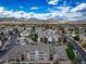 Aerial view of a community with mountain views and spacious grounds at 12093 W Cross Dr # 206, Littleton, CO 80127