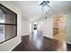 Bright dining room with dark hardwood floors and kitchen access at 12093 W Cross Dr # 206, Littleton, CO 80127