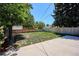 A fenced backyard with grass and a concrete patio, perfect for outdoor enjoyment at 1852 S Decatur St, Denver, CO 80219