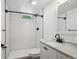 Beautiful bathroom with white tile and dark fixtures at 1852 S Decatur St, Denver, CO 80219