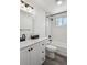 Bathroom with white subway tile, and modern black fixtures and hardware at 1852 S Decatur St, Denver, CO 80219