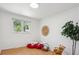 Charming bedroom featuring bright window and fun decor at 1852 S Decatur St, Denver, CO 80219