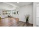 The living room features lots of natural light, wood flooring, and neutral paint at 1852 S Decatur St, Denver, CO 80219